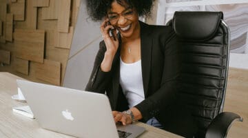 Woman in black blazer sitting on black office chair