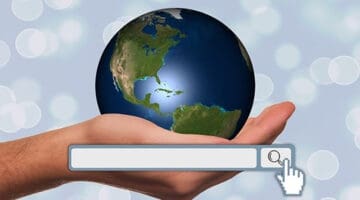 Hand holding a globe