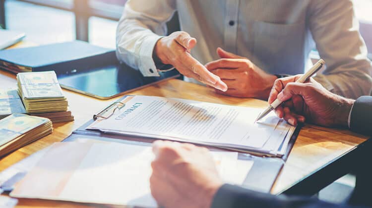 Businessman signing a document