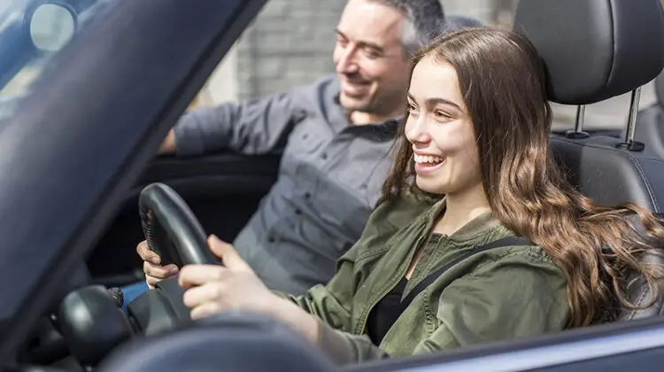 Teen learning drive taking driving test