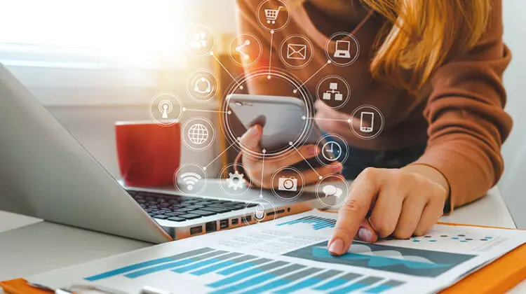 Businesswoman working on her laptop and smartphone
