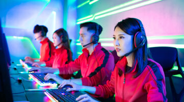 Team Asian teenage cyber gamers