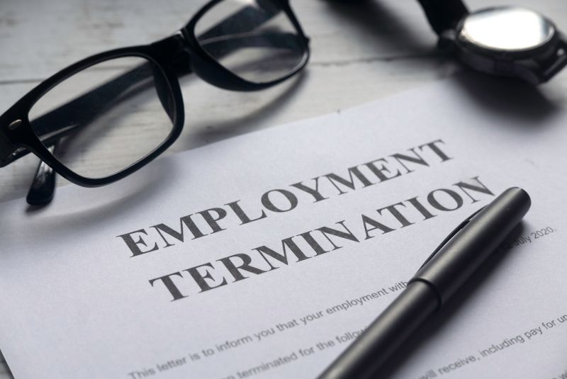 Notice of Employment Termination with Pen and Glasses