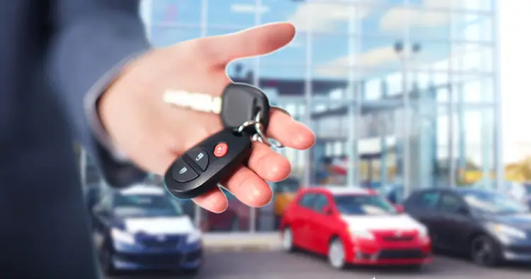 Hand of a person holding car keys