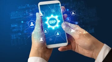 woman holding smartphone showing cloud ERP software icons