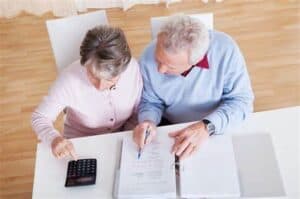 elderly couple doing retirement planning