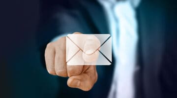 Businessman pointing email icon