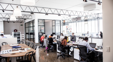 Open plan office with team members working on business branding