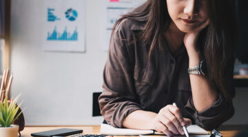Businesswoman using calculator