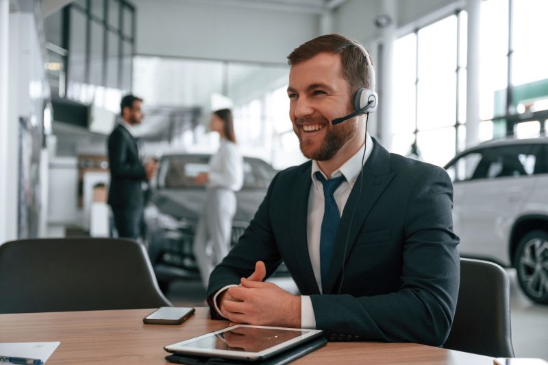 Customer service professional speaking with a potential customer as part of a strategy to attract new customers