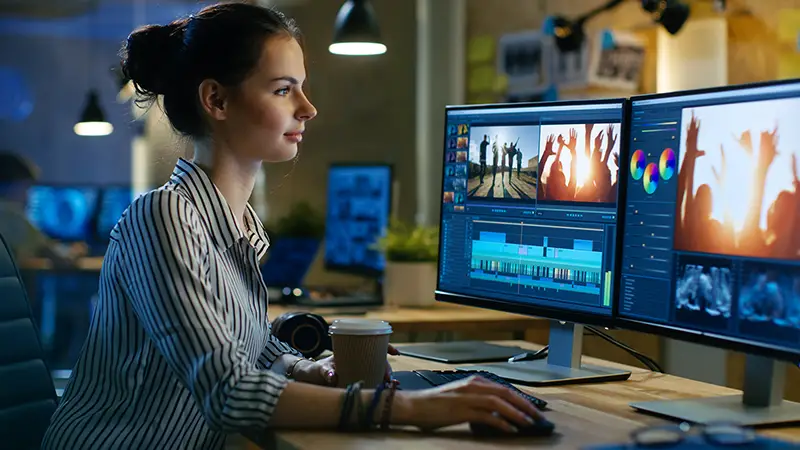 Female Video Editor Works with Footage on Her Personal Computer