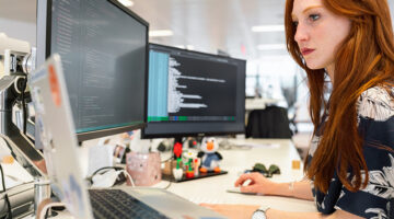 Woman coding on computer
