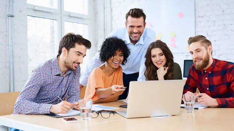 Office colleagues working in a laptop