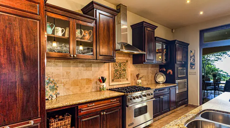 Clean kitchen with dark brown wooden cabinet