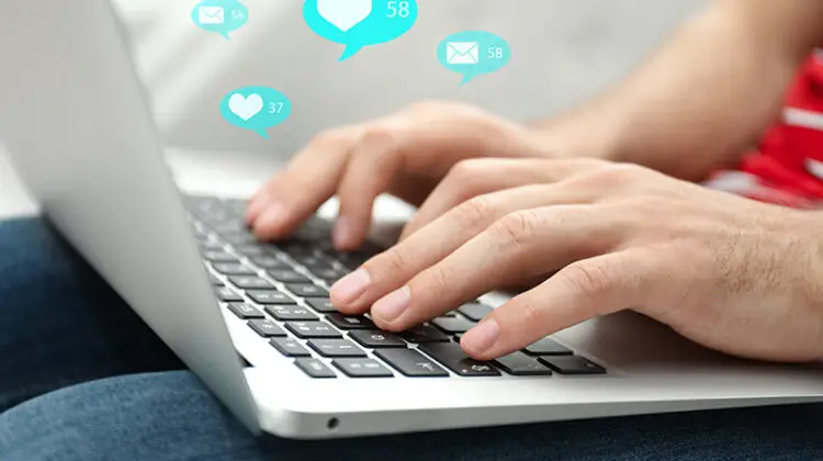 Person using laptop on his lap