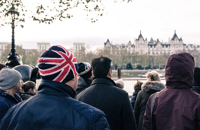 Man standing wearing hat with UK flag colors