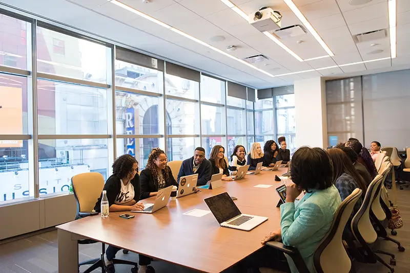 team having a meeting around a conference table.