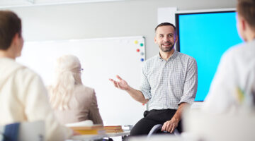 Mortgage educator standing in front of people