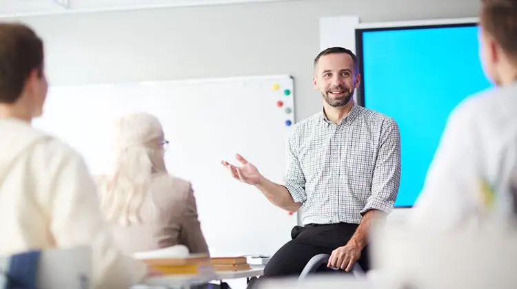 Mortgage educator standing in front of people