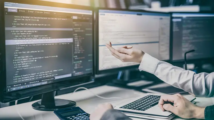 Web developer working in front of his computer