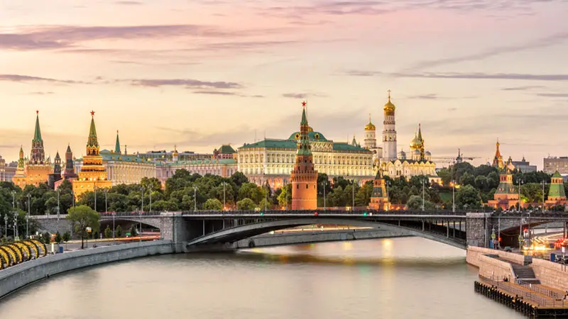Moscow Kremlin at Moskva River, Russia. Panorama of old Moscow in summer evening. Scenic warm view of the ancient Moscow Kremlin at sunset. Beautiful cityscape of the famous Moscow center.
