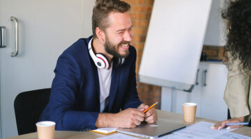 cheerful man in office