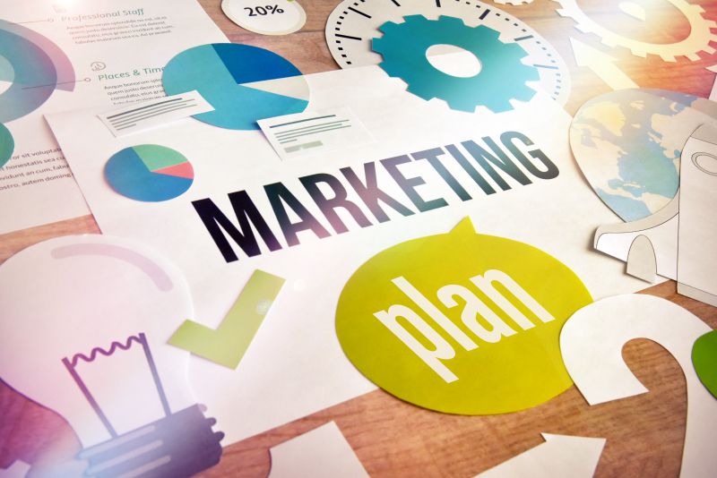 Paper Cutout Marketing Plan on Wood Table