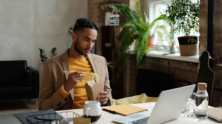 Man in brown long sleeve shirt sitting on chair