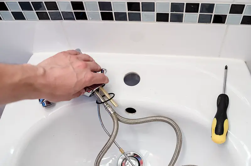 Plumber repair faucet