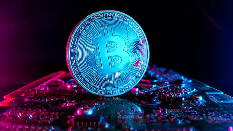 Bitcoin with blue light reflection