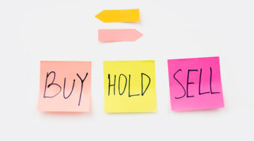 Adhesive sticker pad with text buy, hold, and sell