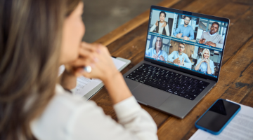 Business woman female team leader manager executive having hybrid office business group meeting, remote workers discussing work plans by video digital conference call on laptop.