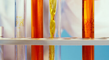 Person pouring mixture in a tube