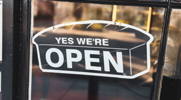 Open sign in shop premises window