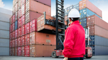 Man wearing red jacket and with hard hat