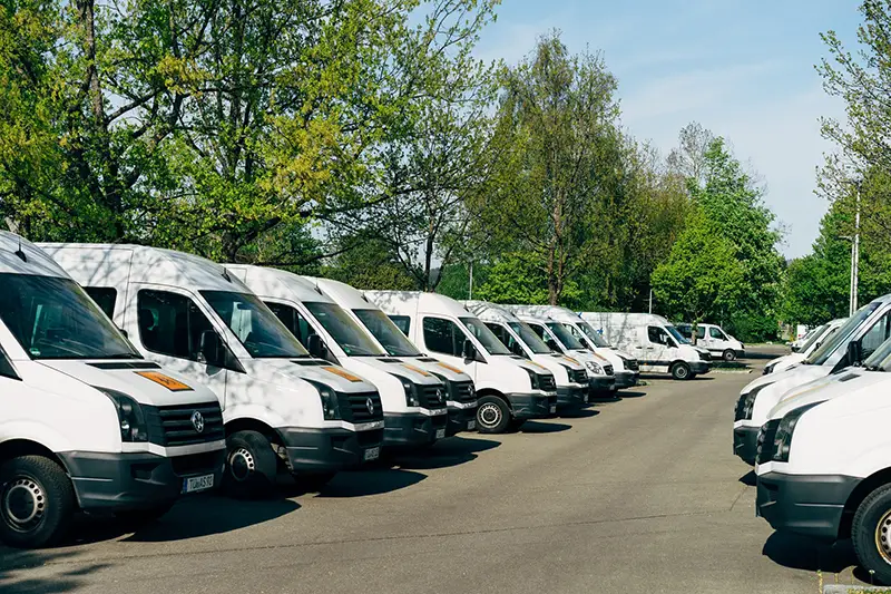Fleet of commercial vehicles in parking lot