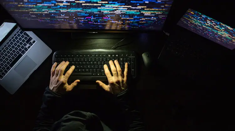 hacker coding at night cybersecurity concept