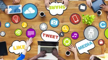 people around brown wooden table and Social media concept
