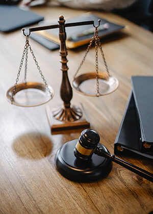 Judge desk with gavel and scales