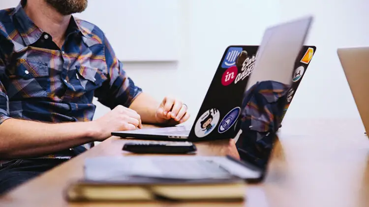 Man sitting in front of laptop