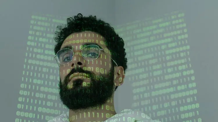 binary code projected on a man's face