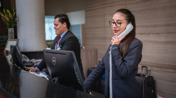 Man and woman receptionist in a hotel