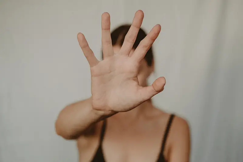 ‘Stop’ hand sign of a woman