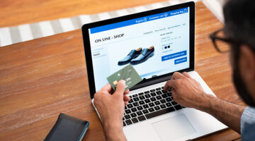 Man buying shoes in online store