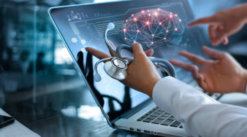 Diagnose checking brain testing result with modern virtual screen interface on laptop with stethoscope in hand