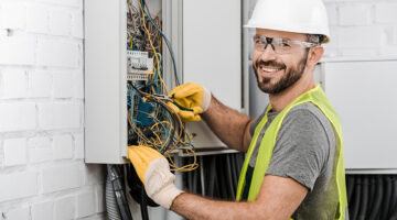 Electrician working in wiring harness