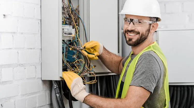 Electrician working in wiring harness