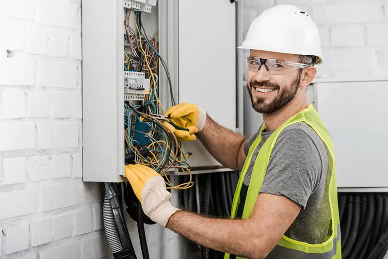 Electrician working in wiring harness