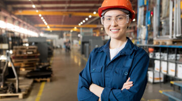 Young smiling female technician in blue uniform,