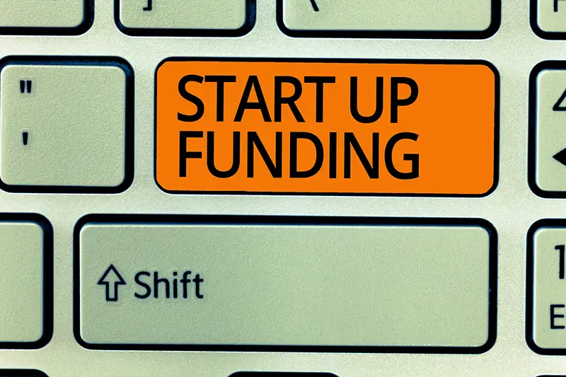 Writing note showing Start Up Funding.